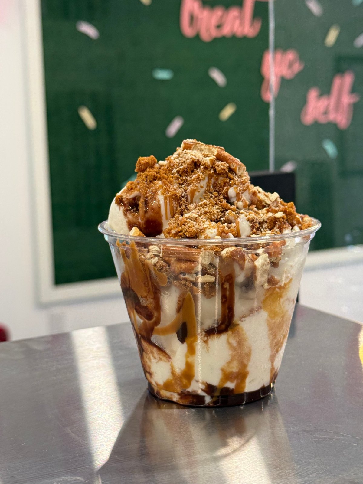 Sweet & Salty Biscoff Delight dairy-free ice cream with Biscoff crumbs, pretzels, caramel, and chocolate sauce